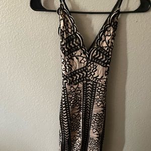 Nude and black dress, cross strap in the back